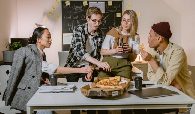 people at the table eating in an office